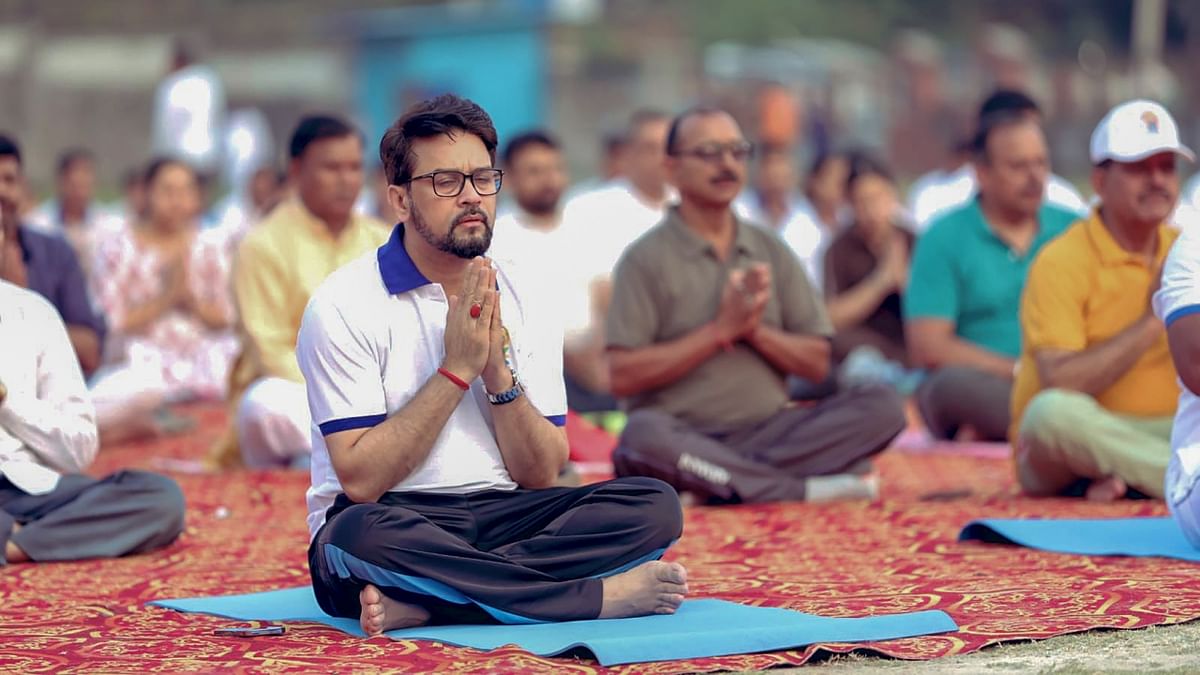Union Minister for Youth Affairs and Sports Anurag Tahkur performs yoga during a session on the International Day of Yoga, in Hamirpur. Credit: Twitter/@ianuragthakur