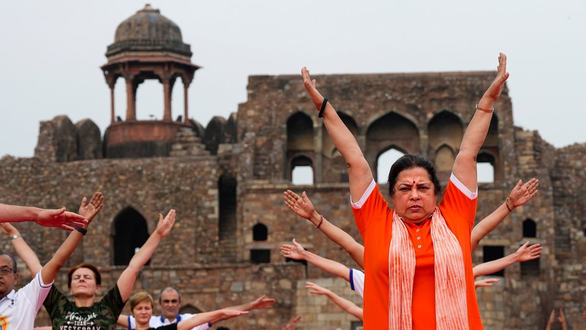 Union Minister of State for External Affairs Meenakashi Lekhi and others perform yoga on the International Day of Yoga at the Old Fort, in New Delhi. Credit: PTI Photo