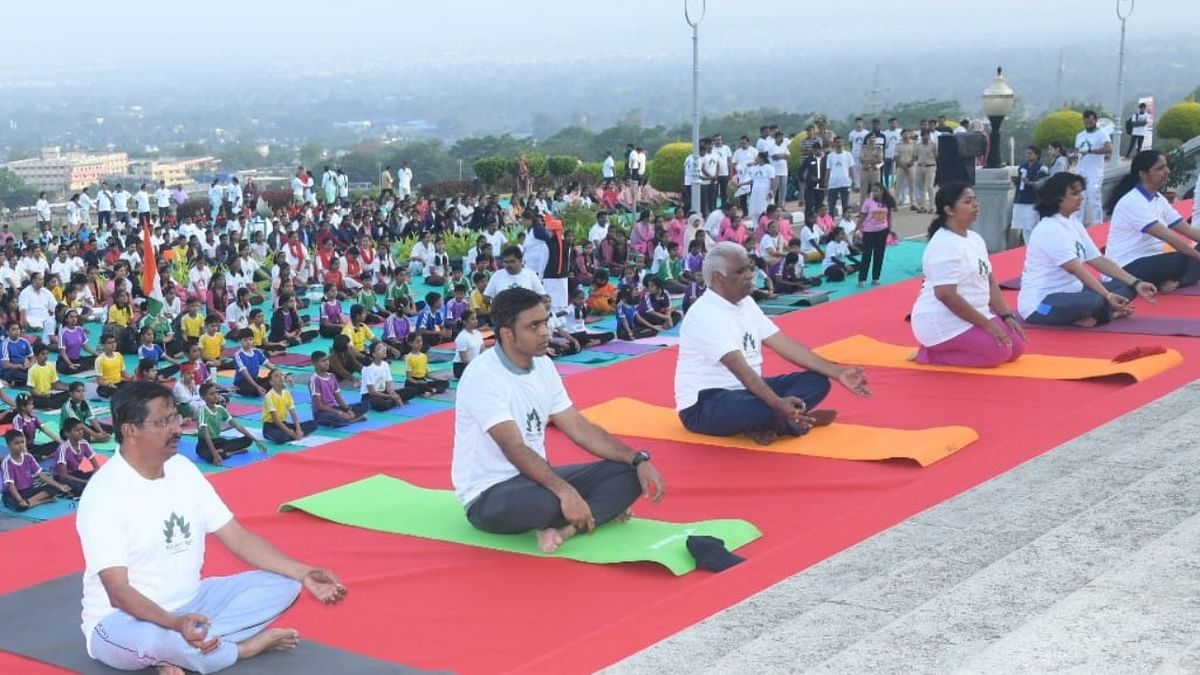MP Iranna Kadadi, ZP CEO Harshal Bhoiyar and others performing yoga during the International Day of Yoga event organised by the District Administration in the premises of Suvarna Vidhan Soudha in Belagavi. CreditL DH Photo