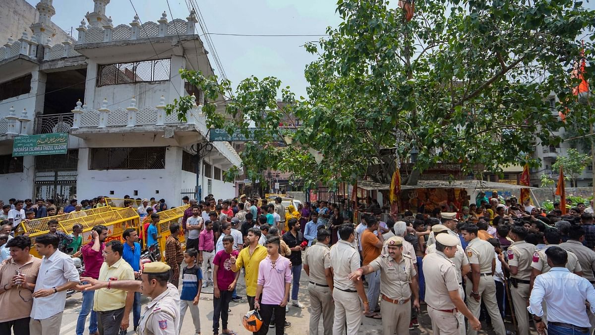 The encroachment drive was carried out by the PWD, police said, adding that the grill that was encroaching on a footpath was removed peacefully in the presence of heavy police deployment. Credit: PTI Photo