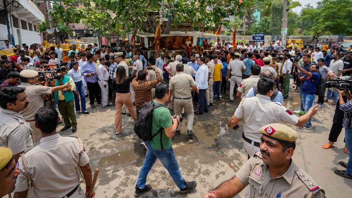 Delhi police personnel tried to bring the situation under control. Reportedly cops detained a few protestors. Credit: PTI Photo