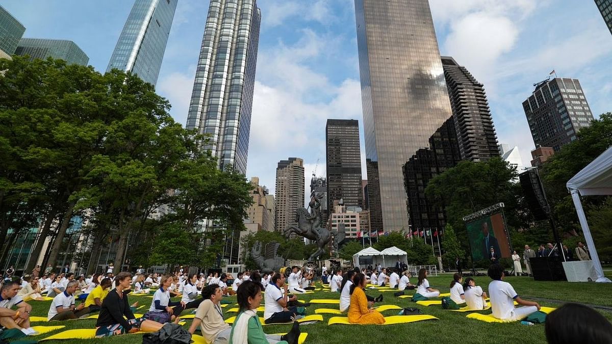 Hundreds of yellow yoga mats were placed on the ground where yoga enthusiasts and practitioners, wearing customised white yoga T-shirts, stretched their bodies, breathed in and out and performed asanas such as 'Tadaasan', 'Brahmari', 'Padahastaasan', 'Vrajaasan', 'Bhujangaasan' and 'Ardhchakraasan' to celebrate the mega event. Credit: Twitter/@narendramodi