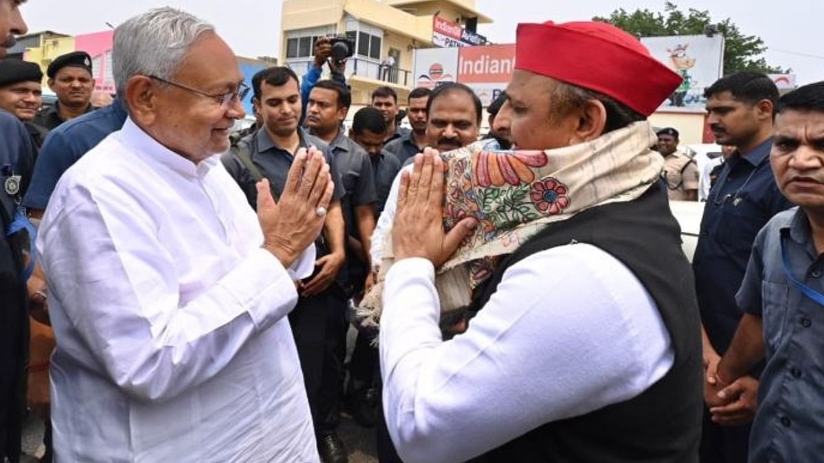 Samajwadi Party chief Akhilesh Yadav being welcomed by Bihar Chief Minister Nitish Kumar on his arrival for the opposition parties meeting, at Patna Airport. Credit: IANS Photo