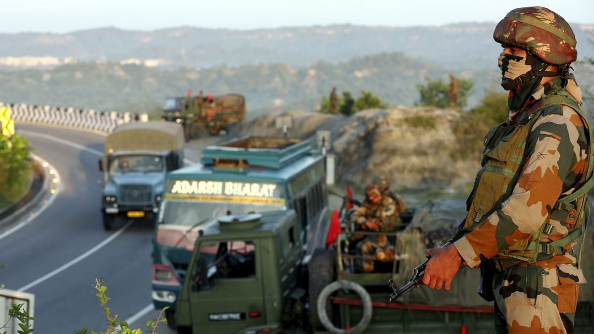 Army personnel keep vigil as a convoy of the second batch of Amarnath Yatra 2023 pilgrims leaves for Kashmir, in Jammu. Credit: PTI Photo