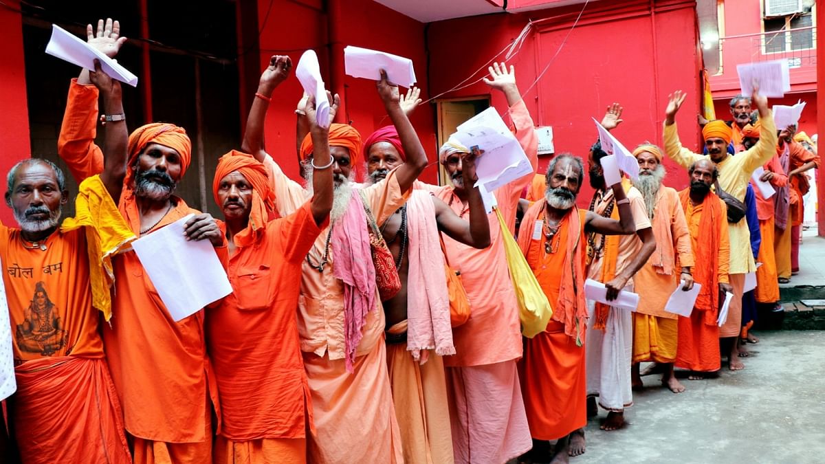 Sadhus get themselves registered for the Amarnath Yatra 2023, at Ram Mandir base camp, in Jammu. Credit: PTI Photo