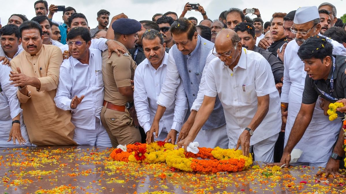 NCP Chief Sharad Pawar with Congress leader Prithviraj Chavan pays tribute to former Maharashtra chief minister Yashwantrao Chavan on Guru Purnima, in Karad, Maharashtra. Credit: PTI Photo
