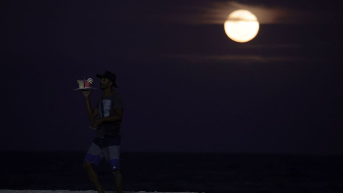 A full moon known as the 'Buck Moon' rises over the Copacabana beach in Rio de Janeiro, Brazil. Credit: Reuters Photo