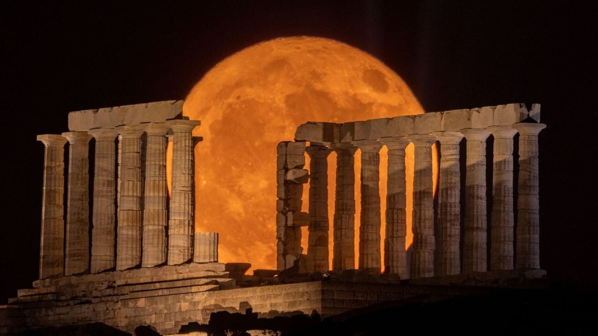 A full moon known as the 'Buck Moon' rises behind the Temple of Poseidon, in Cape Sounion, near Athens, Greece. Credit: Reuters Photo