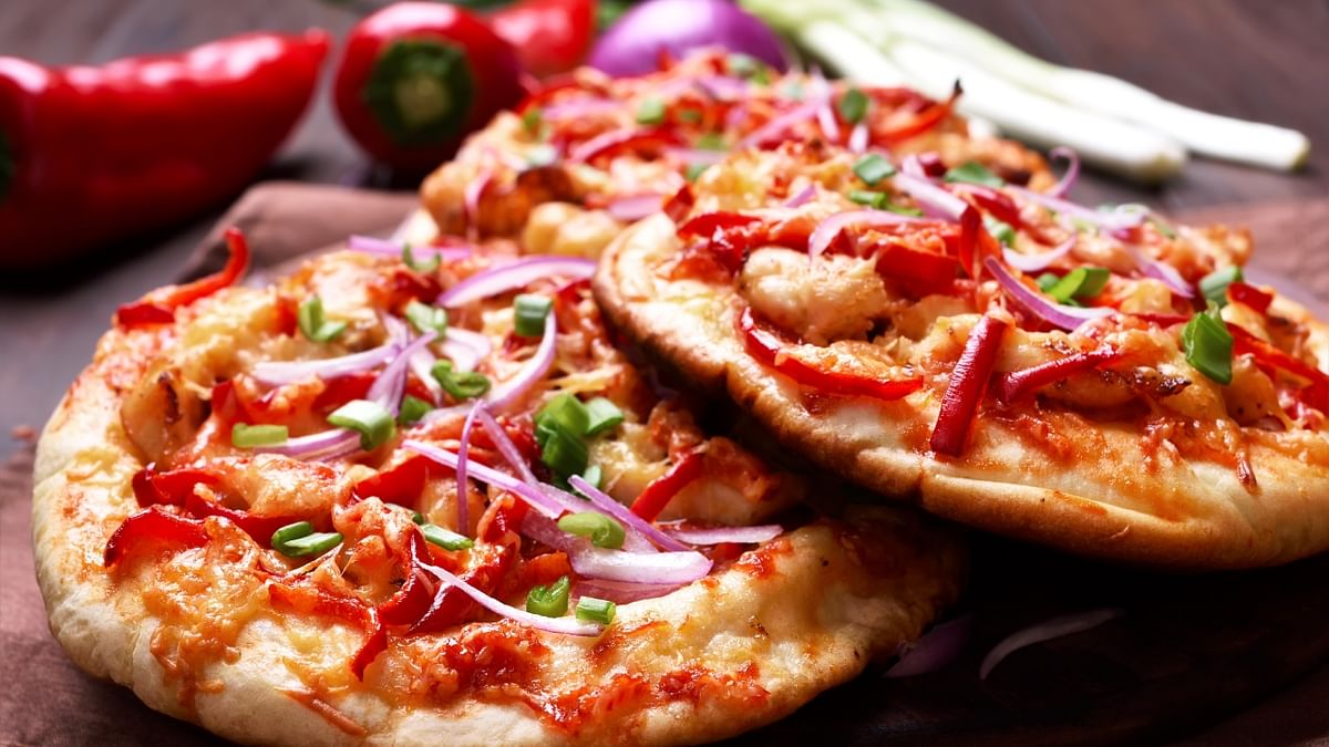 You can also enjoy a freshly baked pizza with your favorite toppings. The combination of melted cheese, savory sauce, and various toppings is hard to resist, making it a great comfort food. Credit: Getty Images