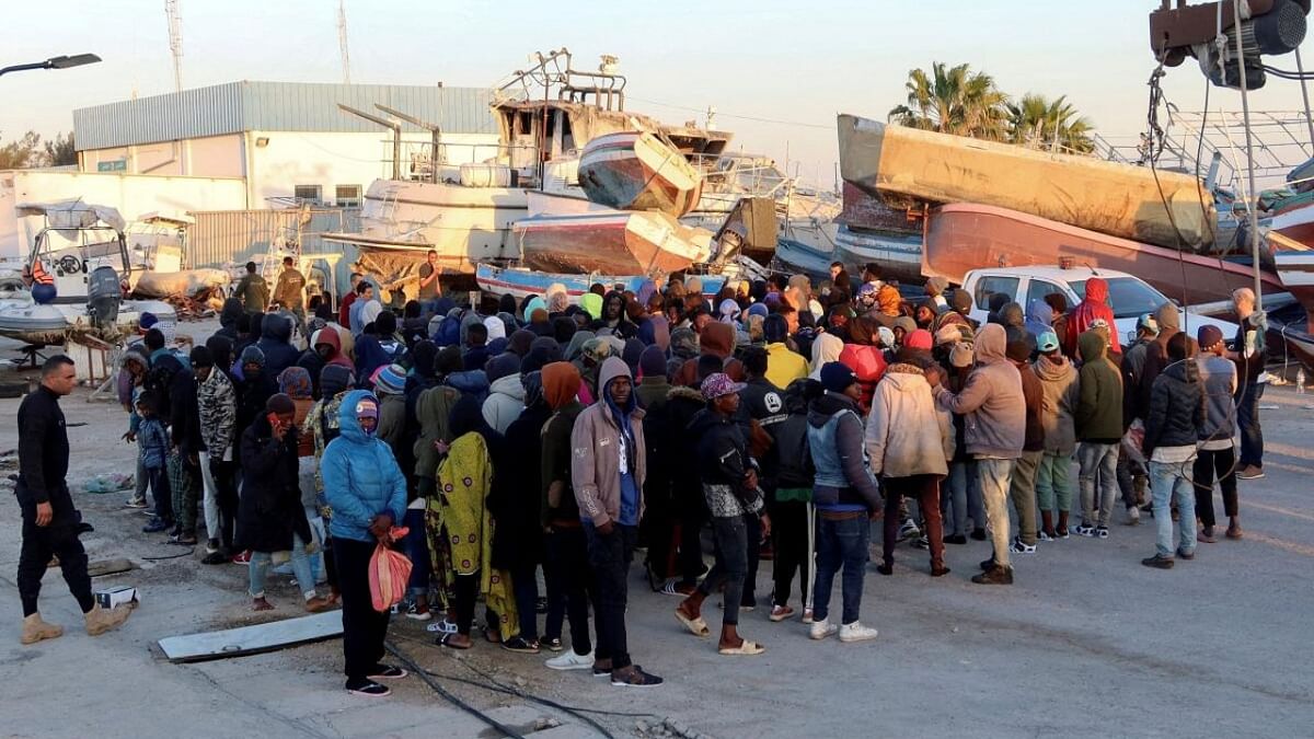 Migrants wait at Sfax port, after being stopped by Tunisian coast guard at sea during their attempt to cross to Italy, Tunisia April 26, 2023. Credit: REUTERS/Jihed Abidellaoui/File Photo