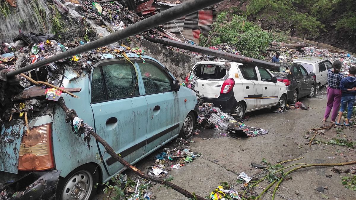 Vehicles covered in debris following heavy rainfall, in Shimla. Credit: PTI Photo