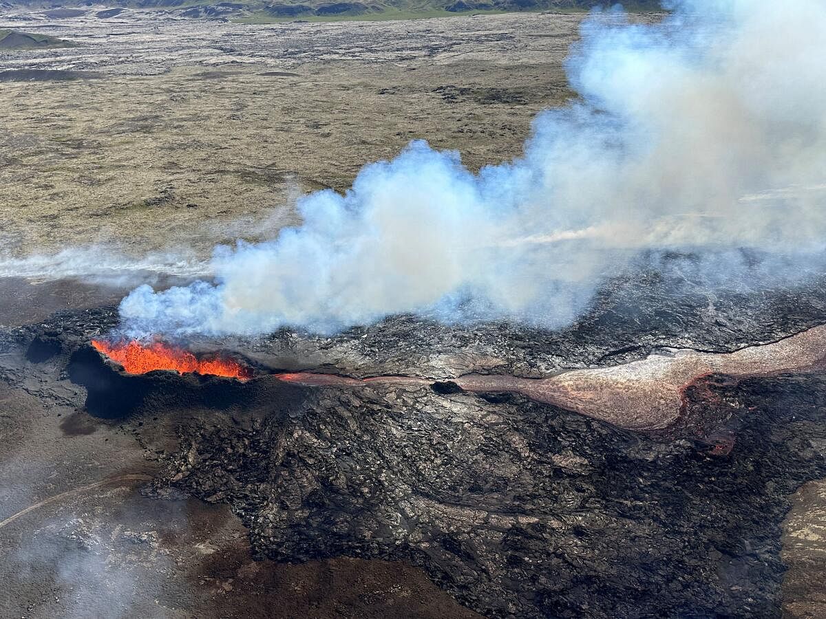 Lava spurts and flows after the eruption of a volcano in the Reykjanes Peninsula, Iceland