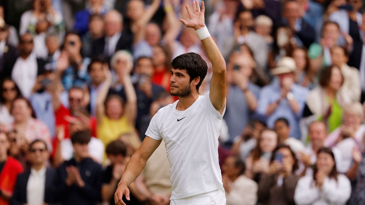 Alcaraz greets audience after winning his final match against Serbia's Novak Djokovic in the Wimbledon 2023 men's singles final in London. Credit: Reuters Photo