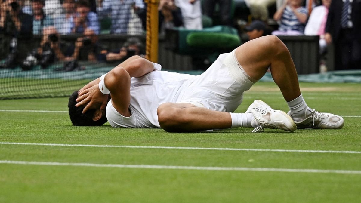 Alcaraz reacts after securing his win against Djokovic in the Wimbledon 2023 men's singles final in London. Credit: Reuters Photo
