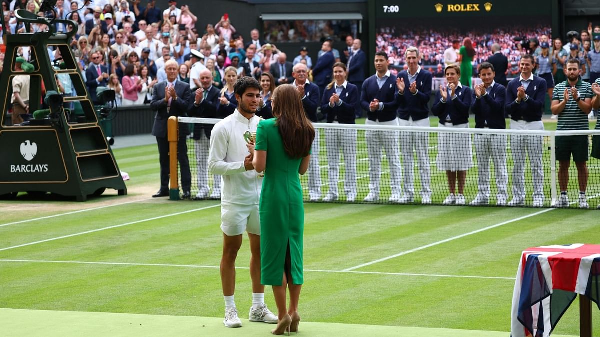 Spain's Carlos Alcaraz receives the trophy from Princess of Wales Catherine after winning his final match against Novak Djokovic in the Wimbledon 2023 men's singles final in London on July 16. Credit: Reuters Photo