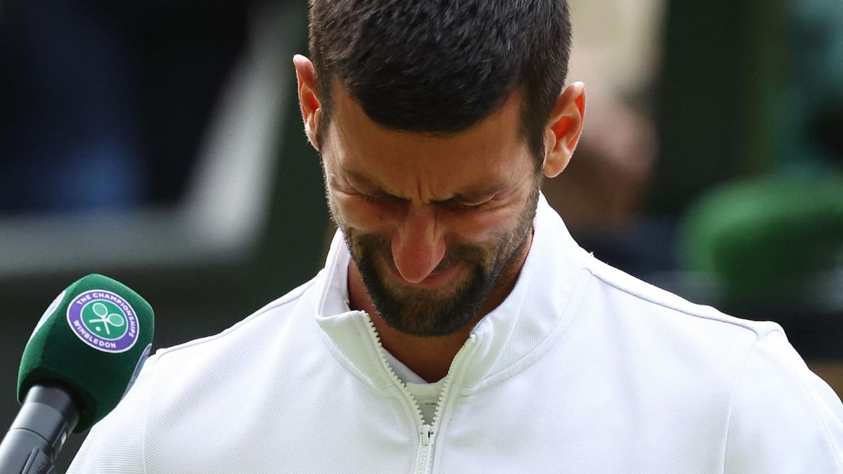 Novak Djokovic chokes while giving an on-court interview after losing Wimbledon 2023 final against Carlos Alcaraz. Credit: Reuters Photo