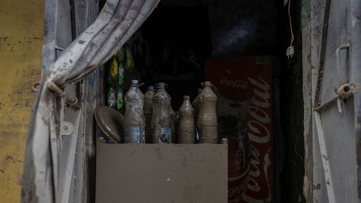 Muddy water bottles photographed inside a shop in New Delhi. Credit: Reuters Photo