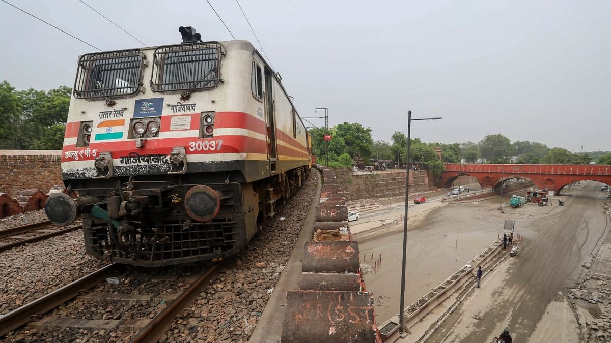 A train runs on the Old Yamuna Bridge after the river's floodwater receded in New Delhi. Credit: PTI Photo