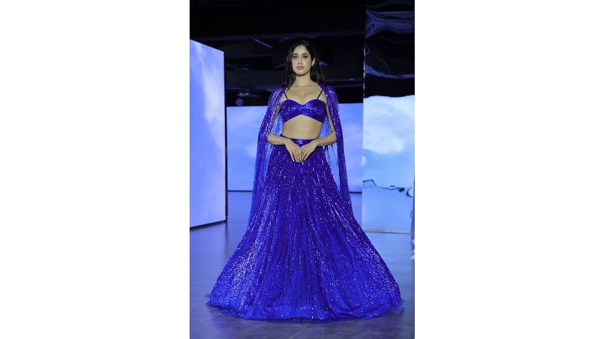 Dressed in an electric blue lehenga crafted by couturier Gaurav Gupta, actor Janhvi Kapoor walked down the ramp to the beats of Indian classical music on the third day of the India Couture Week (ICW) 2023. Credit: PTI Photo