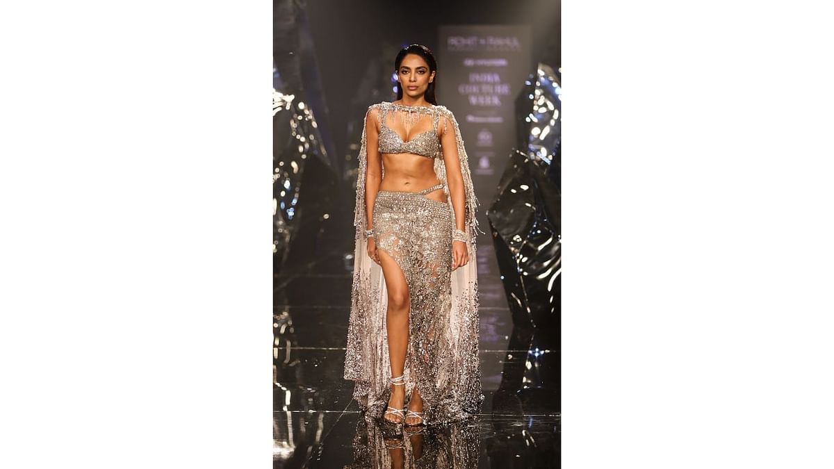 'Made In Heaven' actor Sobhita Dhulipala turned showstopper for designer duo Rohit Gandhi and Rahul Khanna (RGRK) at the FDCI Hyundai India Couture Week. Sobhita was seen in designer duo's latest creations, inspired by the celestial geometry of autumn equinox. Credit: PTI Photo