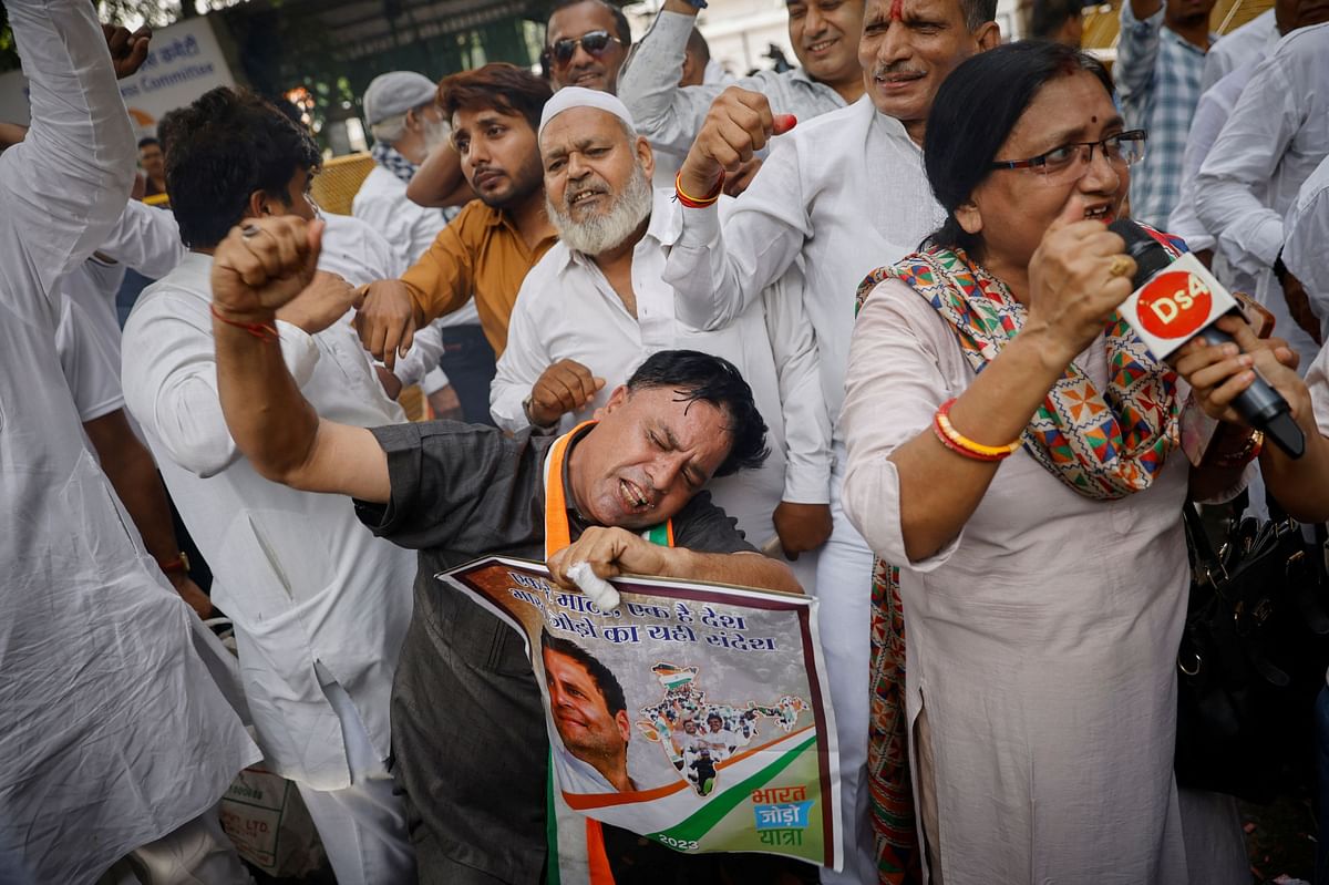 Supporters of Congress celebrate after the Supreme Court suspended party leader Rahul Gandhi's defamation conviction. Credit: Reuters Photo