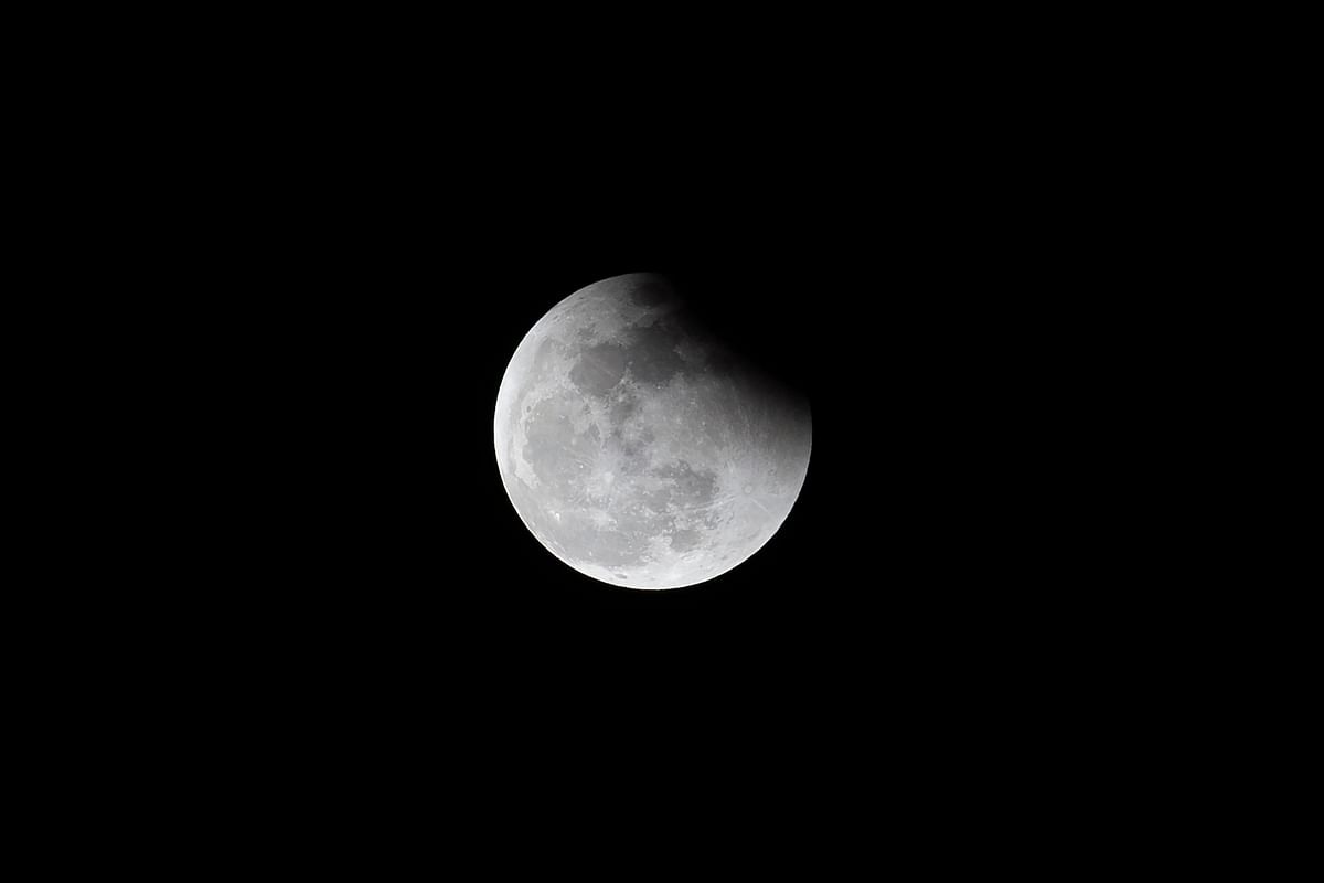 The moon above Manila during the total lunar eclipse, Credit: AFP Photo