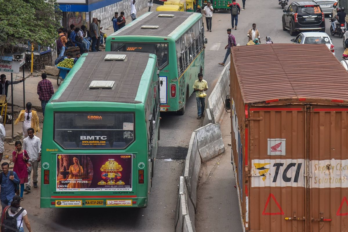 Near Tin Factory junction, in K R Puram, there are dividers on one side to demarcate a single lane as the bus lane.  (DH Photo/S K Dinesh)