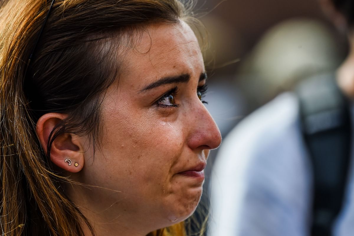 A woman cries as she visits a makeshift memorial in honour of George Floyd, on June 3, 2020 in Minneapolis, Minnesota. Credit: AFP photo