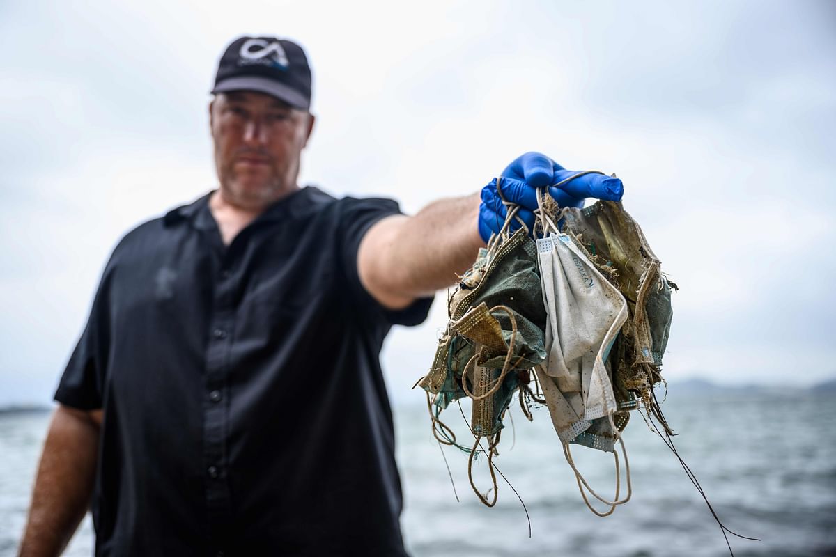 The single use plastic mask is just another additional burden that we are leaving behind for the future generations on the beach. Credit: AFP Photo