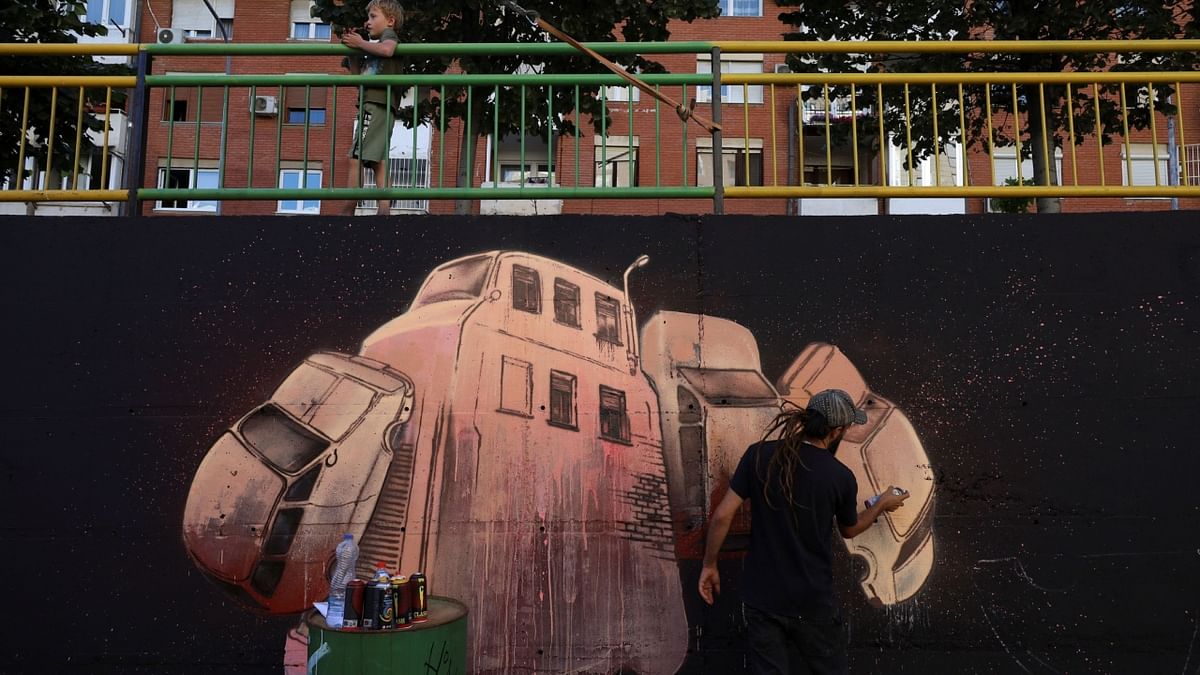 Fran Feo, a graffiti artist from Canary Islands, paints a mural as part of the Meeting of Styles graffiti festival in Kosovo's capital Pristina, Kosovo July 28, 2023. Credit: Reuters Photo