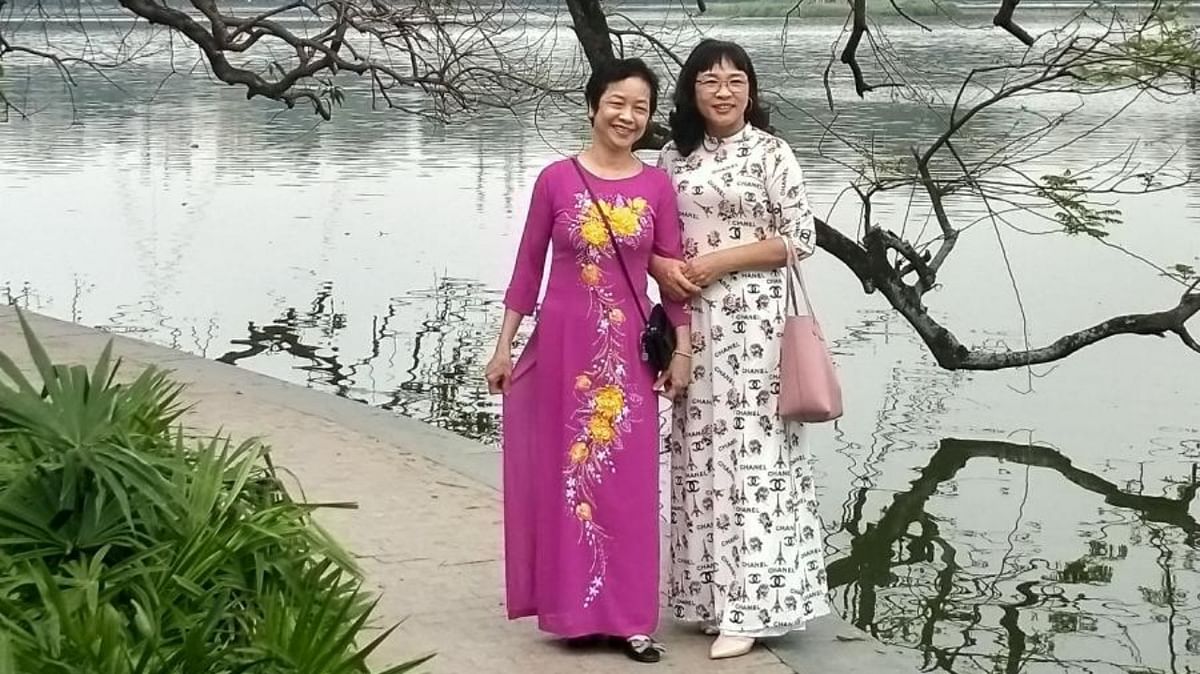 Ladies dressed in Ao Dai