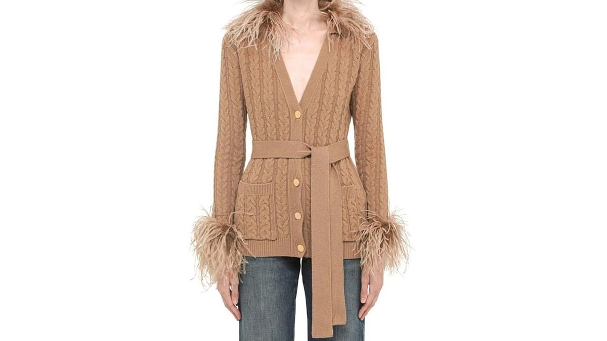Feather touch: This is a beige feathered wool cardigan from Valentino Garavani. It comes with a belted waist and two front patch pockets.