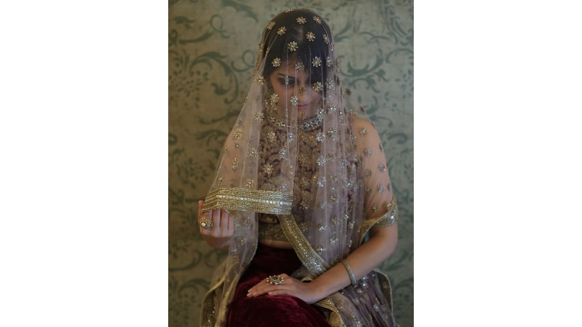 A sheer tulle veil design with zardozi handwork by Bengaluru-based fashion designer Anjali Sharma.