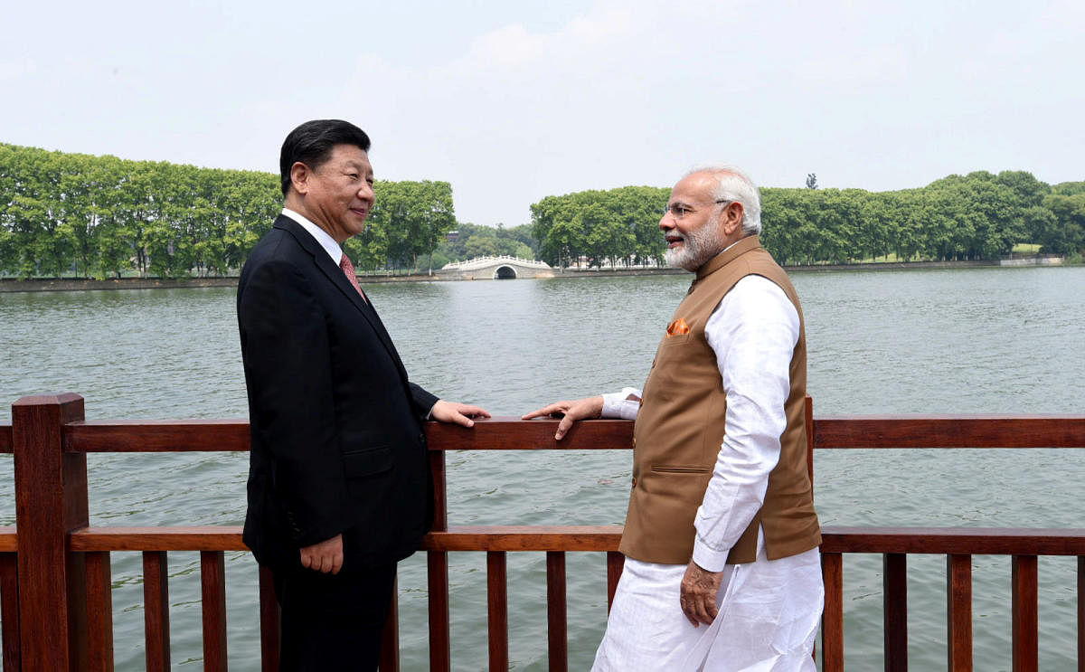 Chinese President Xi Jinping and India's Prime Minister Narendra Modi at the East Lake in Wuhan, China on April 28, 2018. REUTERS 