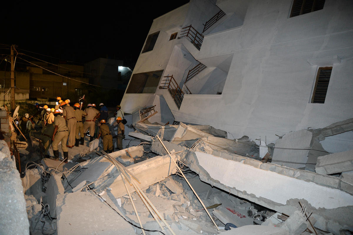 Emergency services personnel search for people trapped under the rubble. 