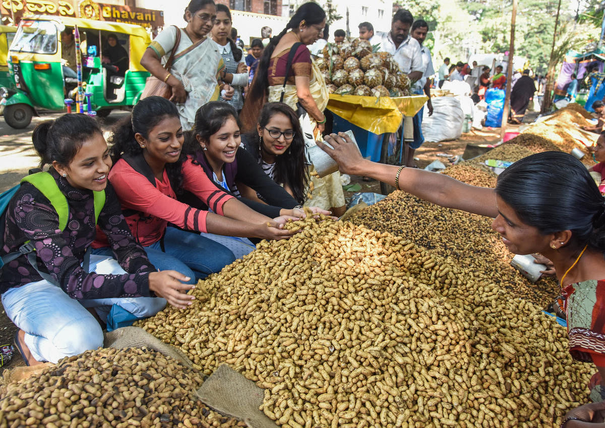 A file photo of women taking part in the traditional and iconic Kadalekai Parishe at Basavanagudi in South Bengaluru in 2019.