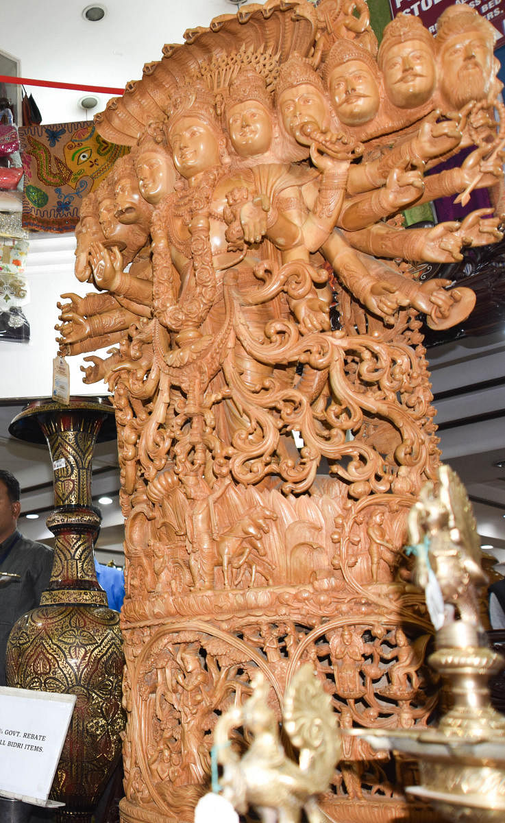 Fading fragrance: Intricate sandalwood carving of a deity.