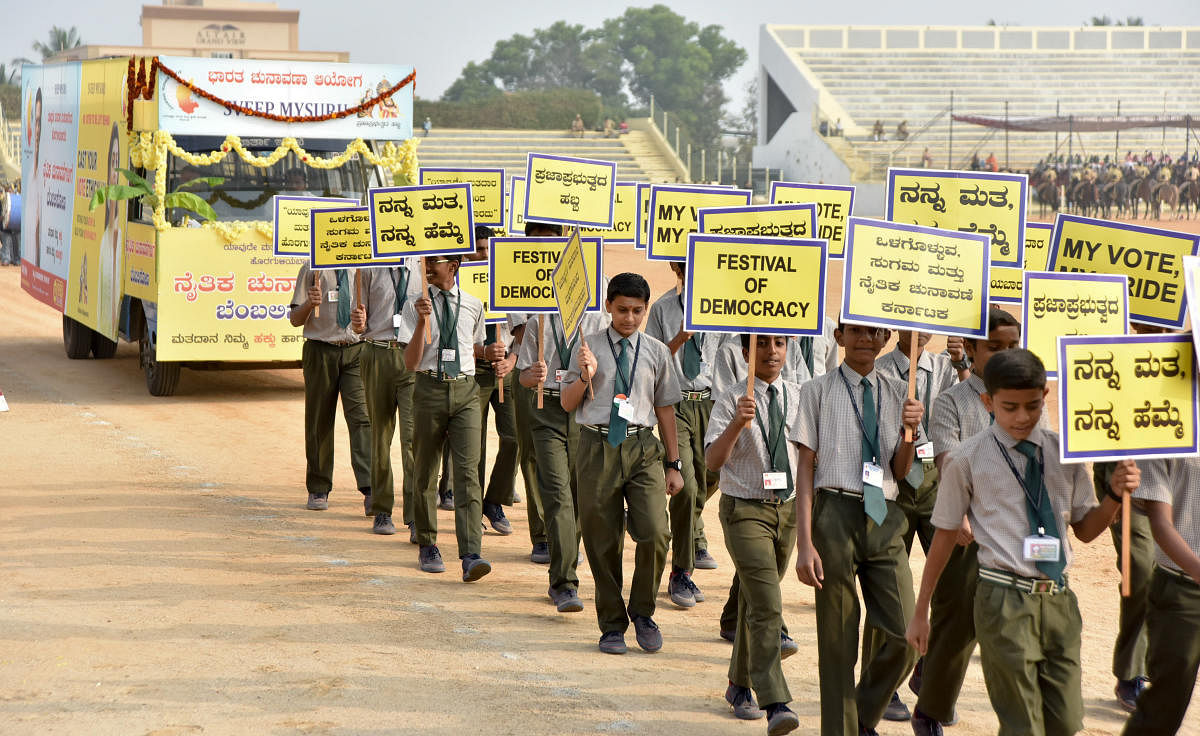 Schoolchildren take out a rally as part of voters awareness drive on the occasion of the Republic Day in Mysuru, recently.