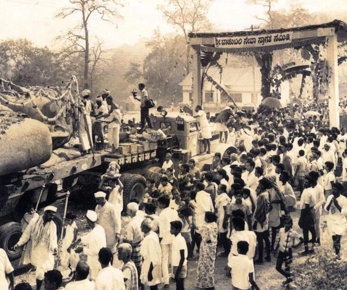 Witness: Maha Mastakabhisheka ceremony at Dharmastala; Brahmastamba ferried on a truck; installation of the Bahubali monolith atop Rathnagiri hill, priest conducting rituals while installing the monolith.