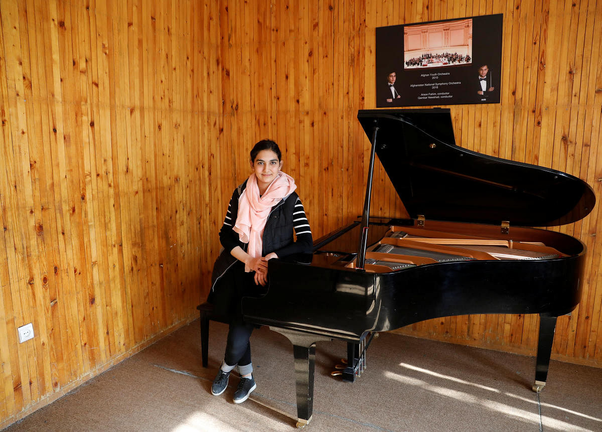Maram Atayee, 16, a pianist at the Afghan National Institute of Music poses for a picture in Kabul, Afghanistan, December 22, 2018. (REUTERS)