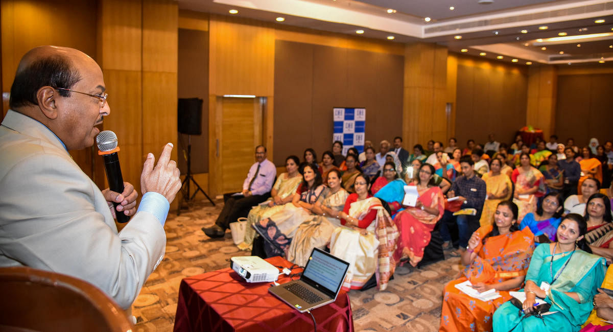 Dr Gururaj Karajagi, Chairman, Academy for Creative Teaching, addresses school principals at a seminar organised by DHiE in association with the Karnataka Milk Federation and Mysore Sales International Limited on Wednesday. DH PHOTO/S K DINESH