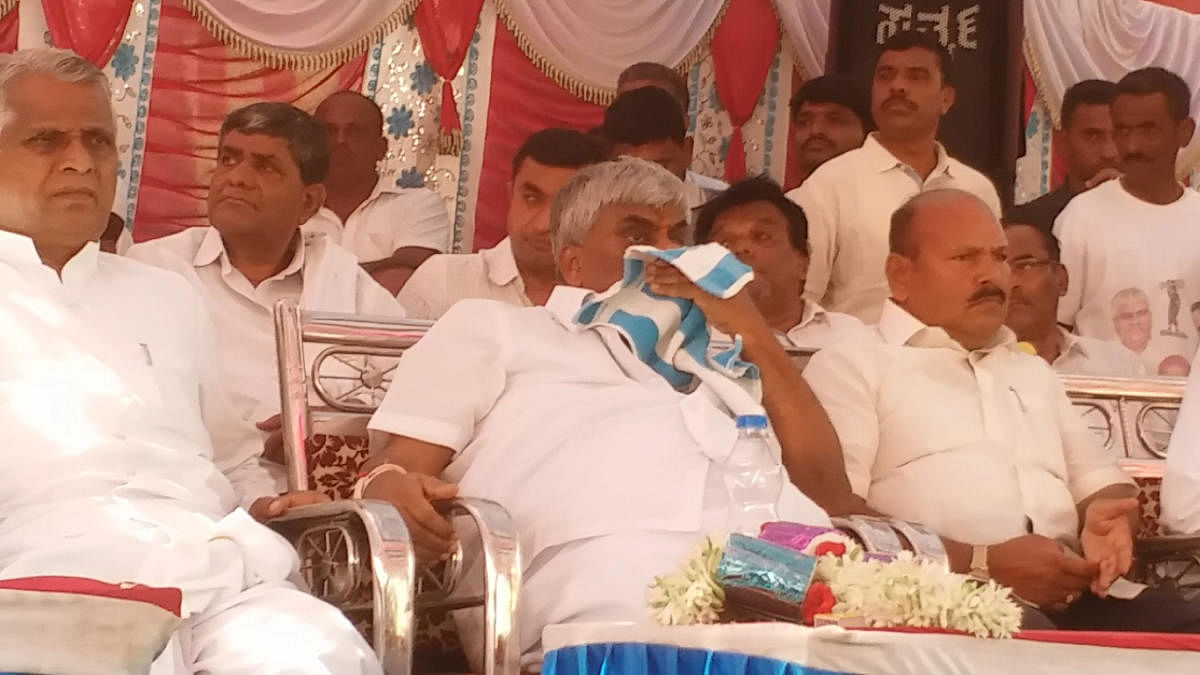 Minister H D Revanna turns emotional during his father Deve Gowda's speech.