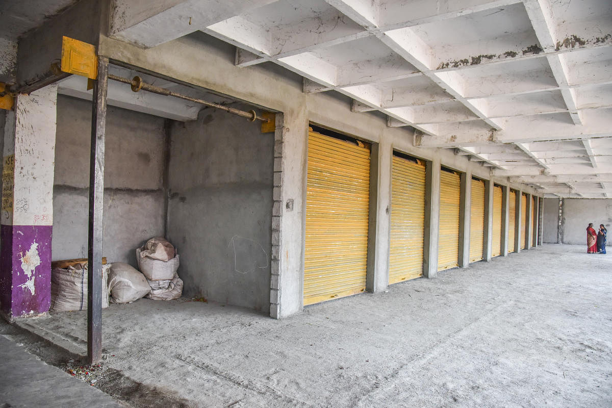 The shuttered illegal shops in KR Market on Thursday. DH Photos/S K Dinesh
