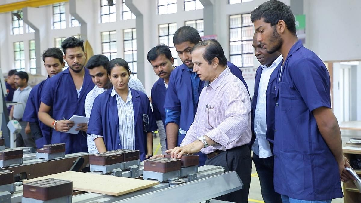 One of the staff members interacts with students at the Advanced WoodworkingTraining Center, located on the premises of Institute of Wood Science and Technology in Malleswaram in Bengaluru,