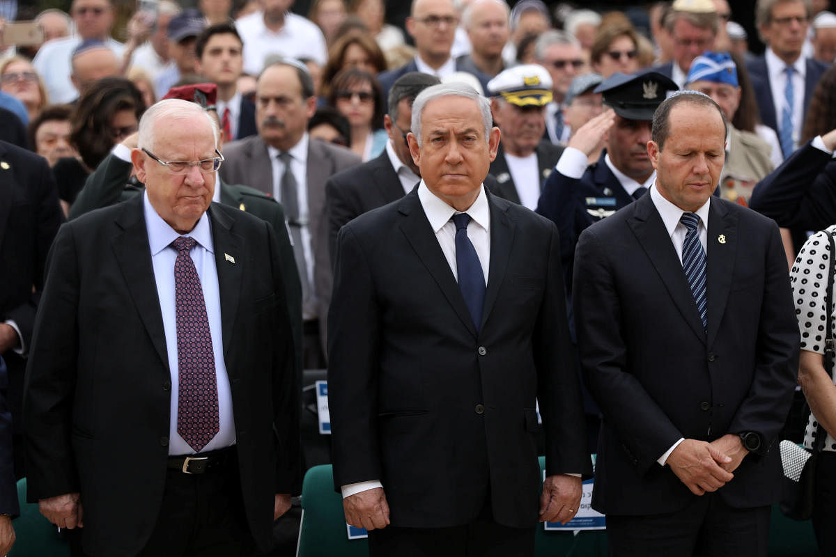 Israeli Prime Minister Benjamin Netanyahu and Israeli President Reuven Rivlin attend a ceremony marking the annual Holocaust Remembrance Day at Yad Vashem Holocaust Memorial in Jerusalem May 2, 2019. Abir Sultan/Pool via REUTERS
