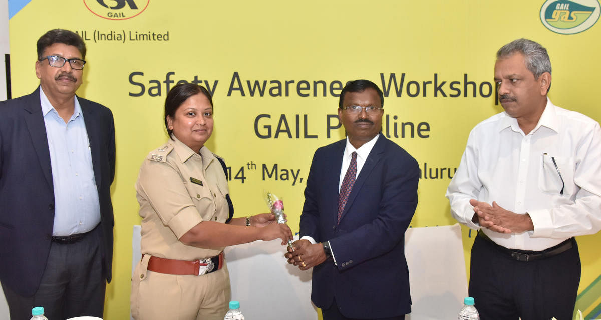 GAIL executive director (southern region) P Murugesan greets Deputy Commissioner of Police (North East Division) Kala Krishnaswamy at a workshop on 'Pipeline Safety' in the city on Tuesday. (From left) Chief general managers Vivek Wathodkar and K P Ramesh