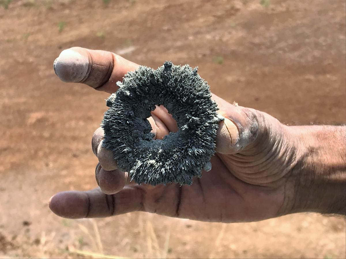 Magnet with ore excavated at borewell site