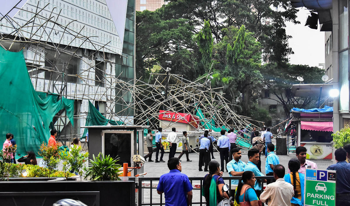 A scaffolding collapsed at Lido Mall off MG Road on Wednesday. DH PHOTO/B K JANARDHAN