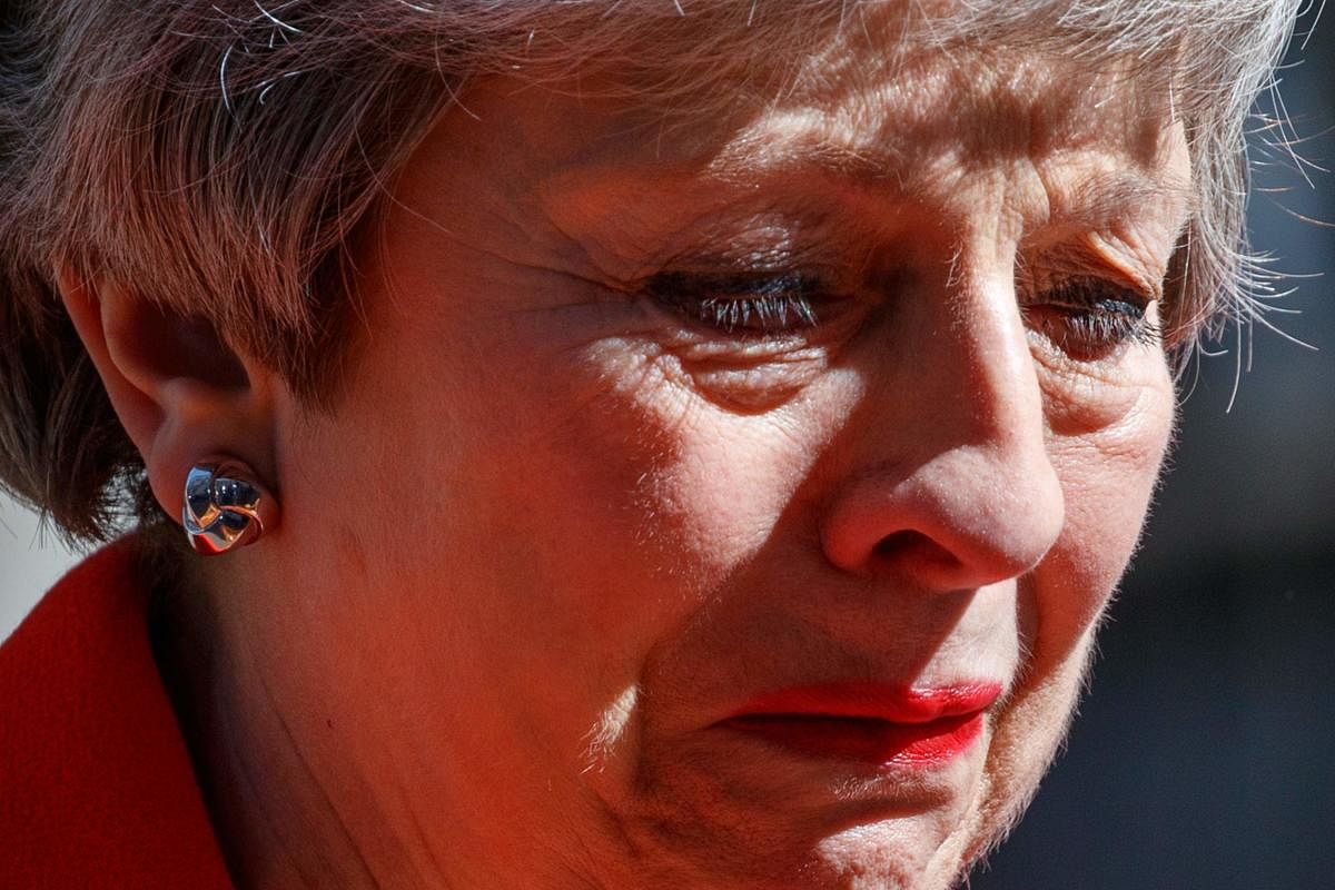 Britain's Prime Minister Theresa May reacts as she announces her resignation outside 10 Downing street in central London on May 24, 2019. (Photo by Tolga AKMEN / AFP)