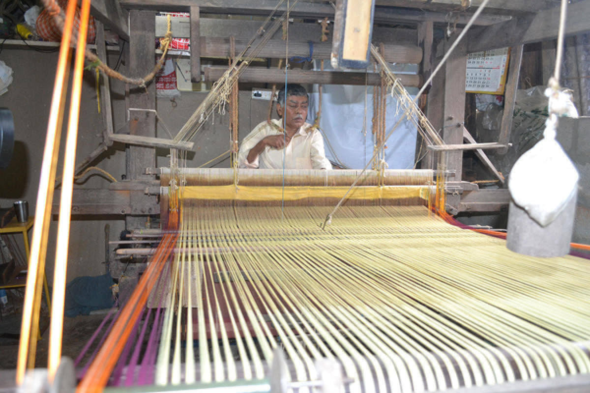Weavers engaged in making Udupi saris